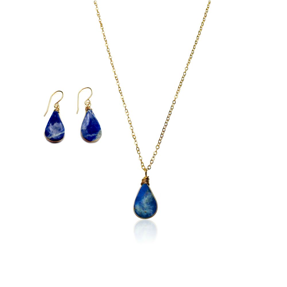 Sodalite jewelry set gold by RUMI SUMAQ. The set includes beautiful Sodalite stones cut in a teardrop shape and expertly set in gold filled wire. The chain is dainty and delicate making it a lovely gift set form someone who loves minimalist jewelry.
